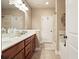 Bathroom features a double sink vanity with modern fixtures, a large mirror, and a separate shower and tub area at 3286 Crawford Cir, Marietta, GA 30066