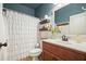 Stylish bathroom featuring a vanity with a vessel sink, a large mirror, and a decorative shower curtain at 3286 Crawford Cir, Marietta, GA 30066
