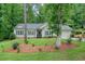 Charming single-story home with manicured front lawn, mature trees, and welcoming curb appeal at 3286 Crawford Cir, Marietta, GA 30066