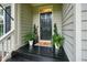 Charming front porch with decorative plants and a welcoming doormat at 3286 Crawford Cir, Marietta, GA 30066