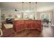 Spacious kitchen island with wood cabinets and bar stool seating, open to the living and dining areas at 3286 Crawford Cir, Marietta, GA 30066
