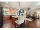 Open concept kitchen and living room, seamlessly flowing with a cozy fireplace and hardwood floors at 3286 Crawford Cir, Marietta, GA 30066