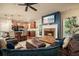 Cozy living room featuring a brick fireplace, comfortable seating, and abundant natural light at 3286 Crawford Cir, Marietta, GA 30066