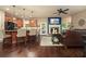 Open-concept living room flowing into a kitchen with a fireplace and bar seating at 3286 Crawford Cir, Marietta, GA 30066