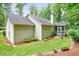 The rear exterior features a well maintained lawn with a screened-in porch that is perfect for relaxing at 3286 Crawford Cir, Marietta, GA 30066