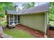The rear exterior features a well maintained yard with a screened-in porch that is perfect for relaxing at 3286 Crawford Cir, Marietta, GA 30066