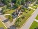 Aerial view of a beautiful single-Gathering home with circular driveway and mature trees in a well-kept neighborhood at 2900 Sutton Pl, Conyers, GA 30013