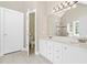 This bathroom has a double sink vanity, a glass-enclosed shower, and neutral paint at 2900 Sutton Pl, Conyers, GA 30013