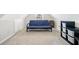 This bonus room features neutral walls, a small window, and a futon couch at 2900 Sutton Pl, Conyers, GA 30013