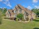 Beautiful two-story brick home with a well-manicured lawn at 2900 Sutton Pl, Conyers, GA 30013