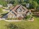 Inviting two-story brick home with manicured lawn and mature landscaping at 2900 Sutton Pl, Conyers, GA 30013