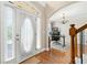 Bright foyer with hardwood floors and view to office/study area at 2900 Sutton Pl, Conyers, GA 30013