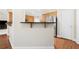 Open concept kitchen with bar and stainless steel refrigerator at 2900 Sutton Pl, Conyers, GA 30013