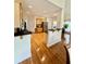 A spacious kitchen featuring stainless steel appliances, a breakfast bar, and hardwood flooring at 2900 Sutton Pl, Conyers, GA 30013