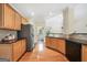 Bright kitchen featuring granite countertops, wooden cabinets, and stainless steel appliances at 2900 Sutton Pl, Conyers, GA 30013