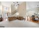 Spacious living area with high ceilings, staircase, and seamless flow into the dining area at 2900 Sutton Pl, Conyers, GA 30013