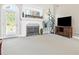 Welcoming living room with fireplace and access to the outside at 2900 Sutton Pl, Conyers, GA 30013