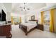 Comfortable main bedroom with sitting area, and plenty of natural light at 2900 Sutton Pl, Conyers, GA 30013