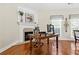 Home office featuring a fireplace, mantle, a wooden desk and two windows at 2900 Sutton Pl, Conyers, GA 30013