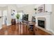 Office space with fireplace, large wooden desk, modern monitors, and hardwood floors at 2900 Sutton Pl, Conyers, GA 30013