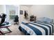 Cozy bedroom with a gamer's setup, featuring a sleek desk and blue accents at 2909 Emme Ct, Conyers, GA 30094