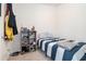 Comfortable bedroom with a single bed, shelf and ample storage space at 2909 Emme Ct, Conyers, GA 30094