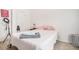 Simple bedroom with a comfortable bed, artwork, and good lighting at 2909 Emme Ct, Conyers, GA 30094