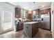 Modern kitchen with stainless steel appliances, granite countertops, an island, and ample cabinet space at 2909 Emme Ct, Conyers, GA 30094