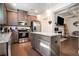 Spacious kitchen with stainless steel appliances, granite countertops, island, and hardwood floors at 2909 Emme Ct, Conyers, GA 30094