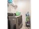 Clean laundry room with stainless steel appliances, storage racks, and tile floors at 2909 Emme Ct, Conyers, GA 30094