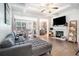 Bright, open living room with fireplace, coffered ceilings, hardwood floors, and modern furnishings at 2909 Emme Ct, Conyers, GA 30094