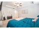 Bright main bedroom features a tray ceiling, ceiling fan, and walk-in closet at 2909 Emme Ct, Conyers, GA 30094