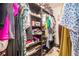 Well-organized walk-in closet with shelving, hanging racks, and ample storage space at 2909 Emme Ct, Conyers, GA 30094