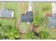 This aerial view showcases a home with a well-manicured lawn and mature trees in a peaceful neighborhood at 3190 Water Brook Sw Dr, Conyers, GA 30094