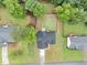 This aerial view showcases a home with a well-manicured lawn and mature trees in a peaceful neighborhood at 3190 Water Brook Sw Dr, Conyers, GA 30094