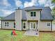 View of backyard with siding, windows, and lawn at 3190 Water Brook Sw Dr, Conyers, GA 30094