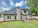 View of backyard with siding, windows, lawn, and privacy fence at 3190 Water Brook Sw Dr, Conyers, GA 30094