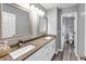 Bathroom with double sink vanity with granite countertop and framed mirrors and toilet room at 3190 Water Brook Sw Dr, Conyers, GA 30094