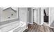 Bathroom featuring a soaking tub and a separate shower at 3190 Water Brook Sw Dr, Conyers, GA 30094