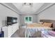 Bedroom featuring carpet, a tray ceiling, and abundant natural light at 3190 Water Brook Sw Dr, Conyers, GA 30094