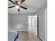 Neutral bedroom featuring a ceiling fan, and a doorway with a view to another room at 3190 Water Brook Sw Dr, Conyers, GA 30094
