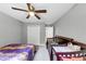 Bedroom featuring a bed, crib and a large window at 3190 Water Brook Sw Dr, Conyers, GA 30094