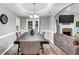Formal dining room featuring wood table, decorative chandelier, and access to outdoor spaces at 3190 Water Brook Sw Dr, Conyers, GA 30094