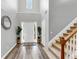 Bright foyer featuring hardwood floors, a staircase, and a soaring ceiling at 3190 Water Brook Sw Dr, Conyers, GA 30094