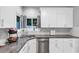 Bright kitchen showcasing granite countertops, stainless steel appliances, and views from the adjacent window at 3190 Water Brook Sw Dr, Conyers, GA 30094