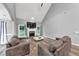 Inviting living room featuring vaulted ceilings, stone fireplace, and neutral décor, perfect for relaxation at 3190 Water Brook Sw Dr, Conyers, GA 30094