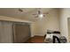 Cozy bedroom with neutral walls, laminate flooring and a ceiling fan at 4965 N Bridges Dr, Alpharetta, GA 30022