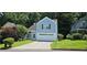 Charming two-story home with a well-maintained lawn and attached two-car garage at 4965 N Bridges Dr, Alpharetta, GA 30022