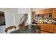 Functional kitchen with stainless appliances and access to upstairs at 4965 N Bridges Dr, Alpharetta, GA 30022