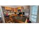 Functional kitchen with stainless steel appliances, an island, and wooden cabinets at 4965 N Bridges Dr, Alpharetta, GA 30022